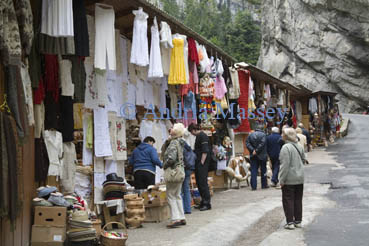 Neamt Moldavia Romania EU September Group of tourists checking the items for sale at the stalls in the narrow gorge of Cheile Bicazului Hamas National Park