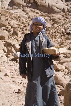 Sinai Egypt North Africa February Young Bedouin boy trying to make a living selling crystal stones 