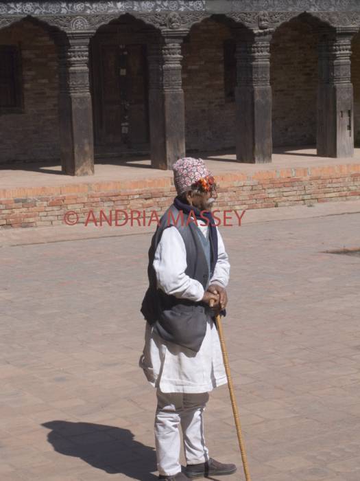 PATAN NEPAL November  An elderly Nepalese man leaning on his stick in Durbar Square