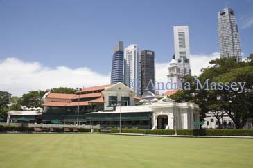 SINGAPORE ASIA May Looking across the bowling green to the World Famous Singapore Cricket Club pavilion with the clock tower of the Chinese High School 