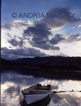 Glenelg Scottish Highlands
Sun rises over the river - a moored boat in the foreground