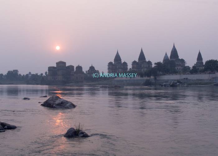 ORCHHA MADHYA PRADESH INDIA November The domes and spires of the chhatris  memorials to Bundelkhand's former rulers from across the Betwa River at sunset