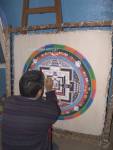 KATHMANDU NEPAL November A young man painting the intricate designs of a Thanka a Buddhist religious painting