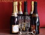 Champagne bottles and flutes with a red background