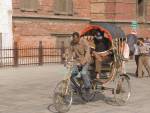 KATHMANDU NEPAL November Bicycle rickshaw rider taking a tourist around Basantpur Chowk to Durbar Square
