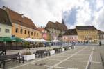 Brasov Transylvania Romania EU September Looking across the pedestrianised Council square flanked by restaurants and banks in the centre of this historic medieval city