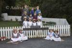 GREYMOUTH CENTRAL SOUTH ISLAND NEW ZEALAND May Group of schoolchildren dressed in 1860s costume posing in front of Marsden Valley School in Shantytown a replica gold mining town