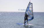 Taba Sinai Egypt North Africa February Young man wind surfing on the calm sea of the Gulf of Aqaba