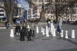 CHRISTCHURCH SOUTH ISLAND NEW ZEALAND May Interested spectators watching two men play chess in Cathedral Square