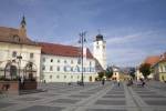 Sibiu Hermannstadt Transylvania Romania Europe September Looking across Piata Mare flanked by the Holy Trinity Catholic Church and Council Tower Turnel Sfatului