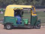 DELHI INDIA November One of the three wheeled auto rickshaws powered by gas to cut the city