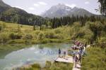 NR KRANJSKA GORA SLOVENIA EU/June
Group of hikers at Zelenci Lake the source of the River Sava with the Julian Alps peaks Visoka Ponca,Jalovec and Planica in the background