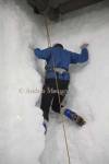 FRANZ JOSEF WEST COAST SOUTH ISLAND NEW ZEALAND May A woman climbing a ice chinmney one of the more difficult of the 15 climbing routes of the indoor ice climbing wall 